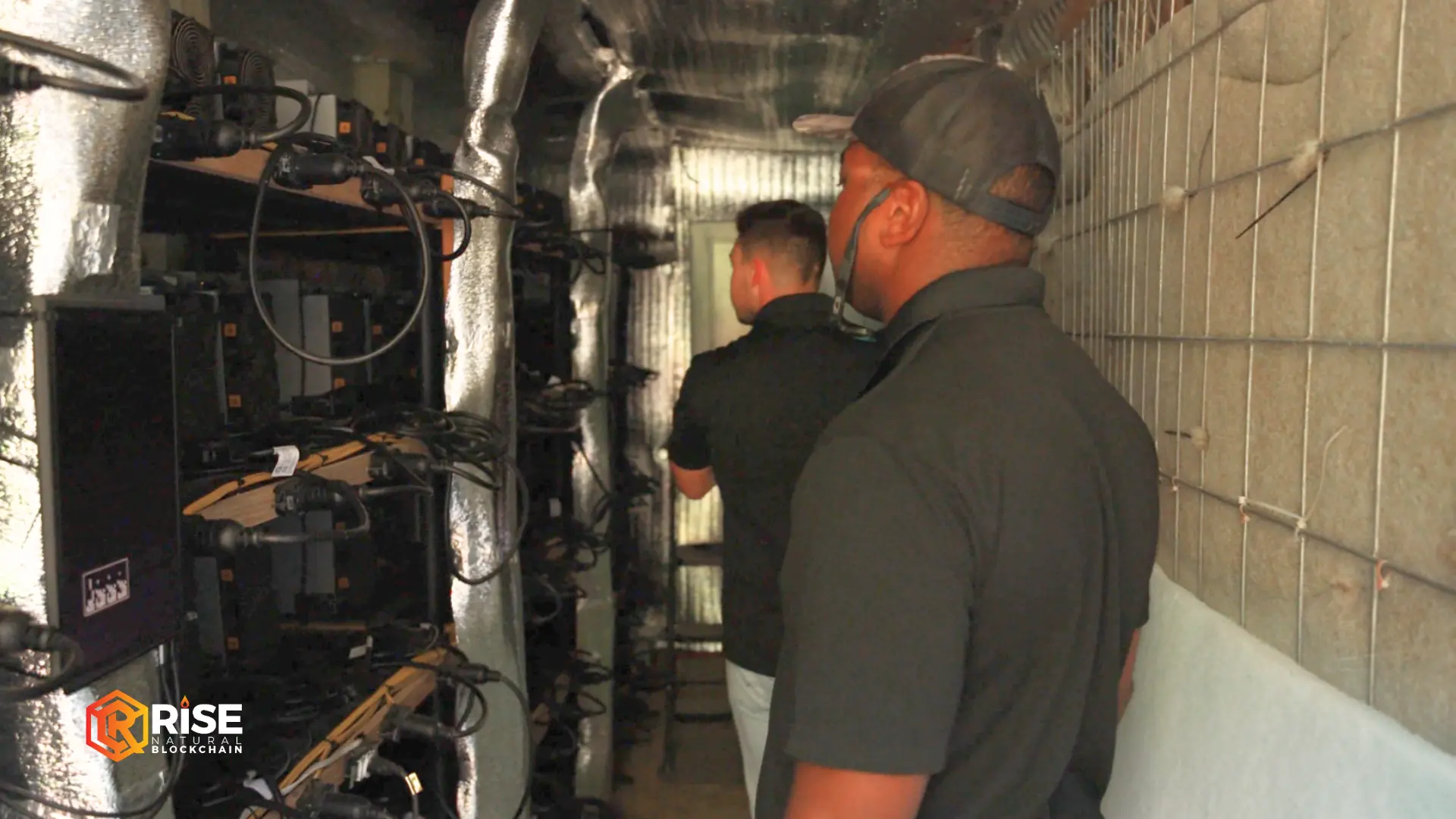 Rise Natural Blockchain technicians inspecting mining hardware on site